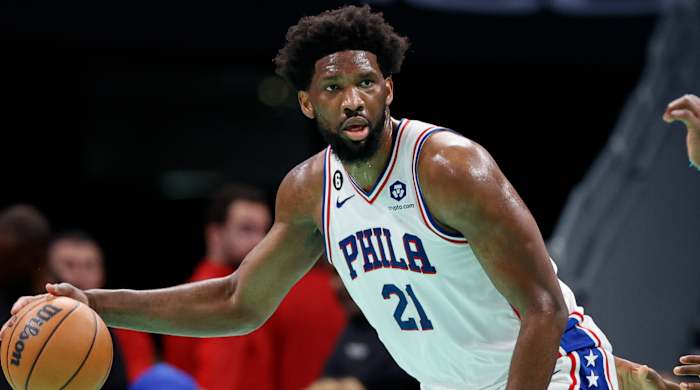 76ers center Joel Embiid looks to pass the ball